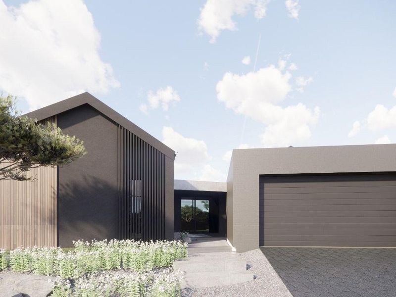 Modern architectural front facade featuring dark exterior cladding, timber accents, a double garage, and a landscaped entrance path.