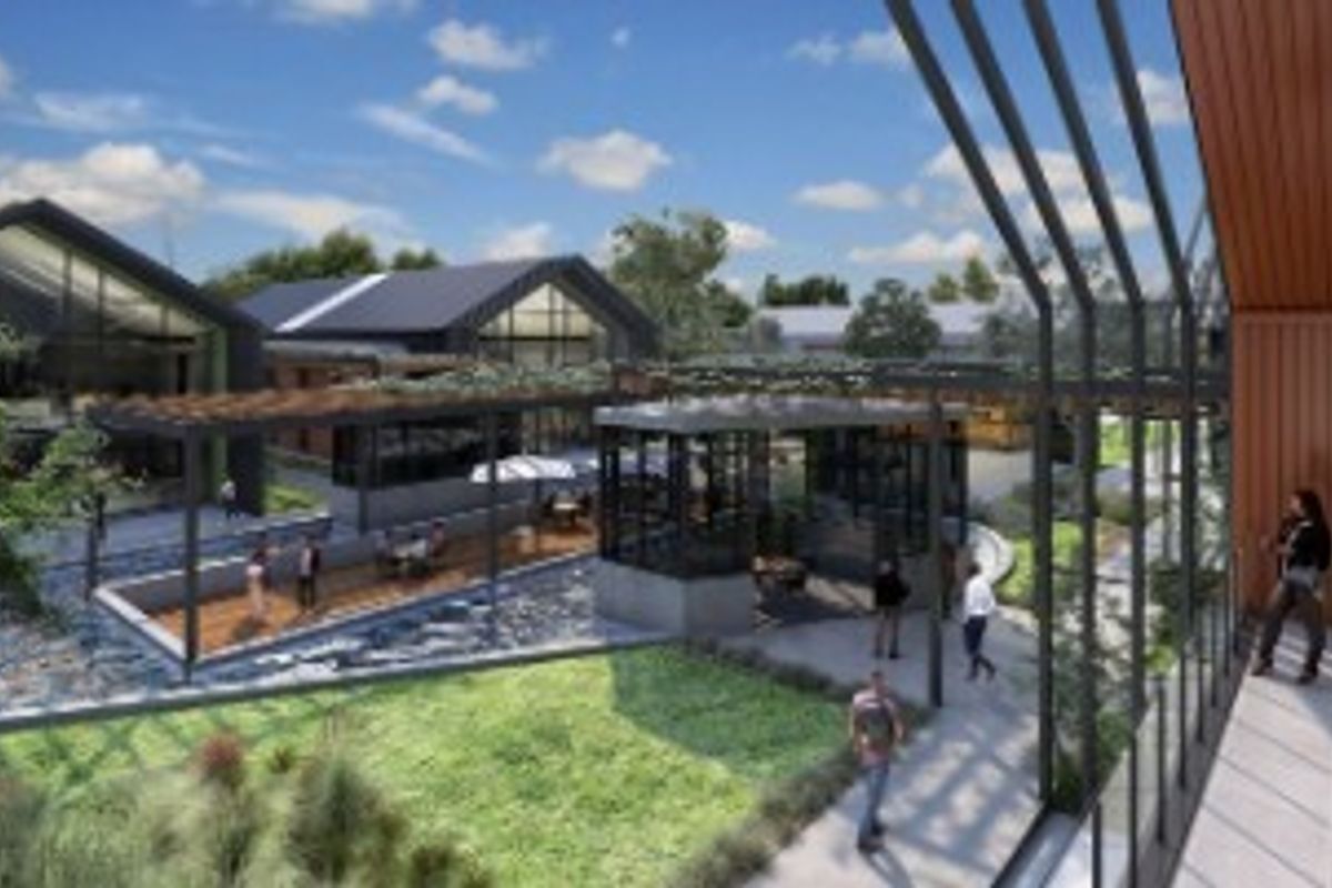 A modern architectural rendering of a landscaped outdoor courtyard area featuring pergolas, paved walkways, and contemporary building structures.