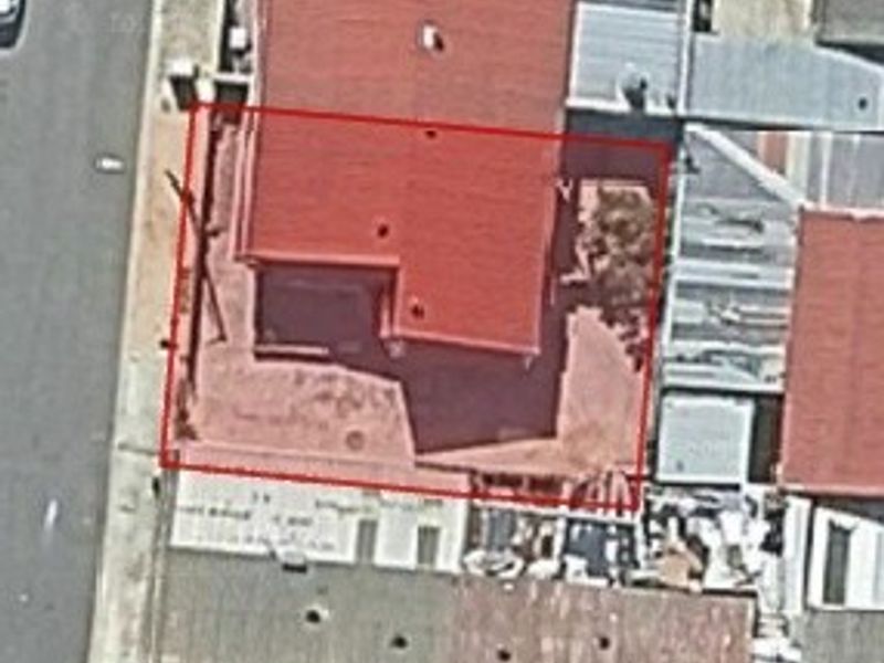 An aerial view of the property showing the roof structure and site boundary.
