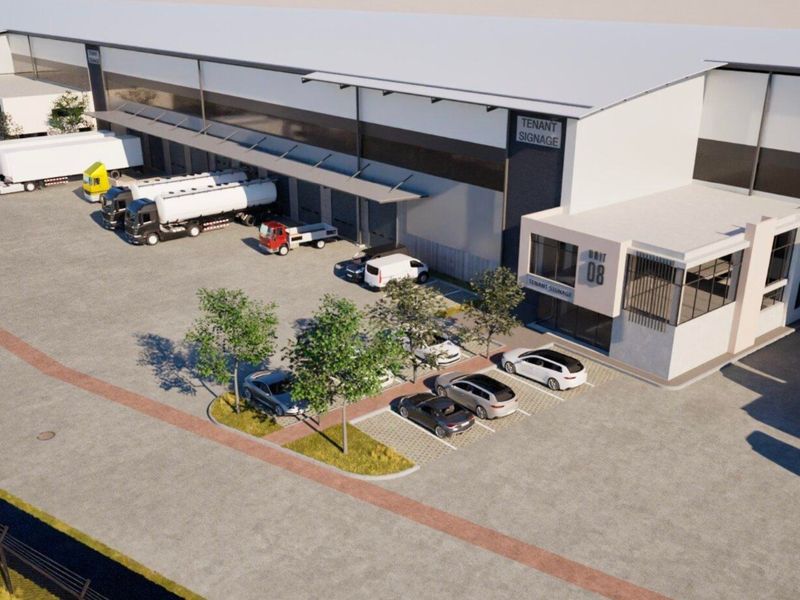 Aerial view of a modern industrial warehouse facility featuring loading bays, dedicated parking, and a secure concrete yard area.