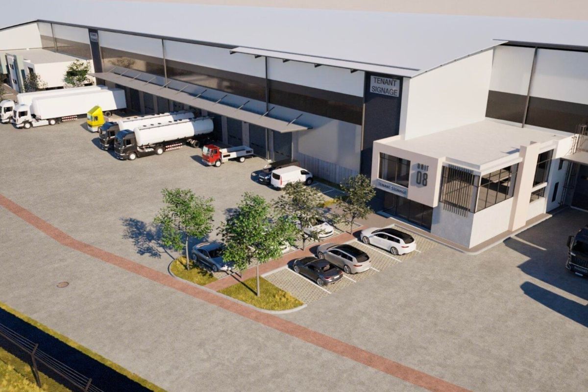 Aerial view of a modern industrial warehouse facility featuring loading bays, dedicated parking, and a secure concrete yard area.