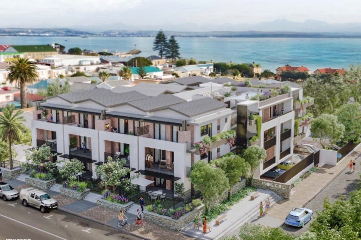 An aerial architectural rendering of a modern apartment complex featuring multi-level balconies, pitched roofs, and landscaped grounds near the coastline.