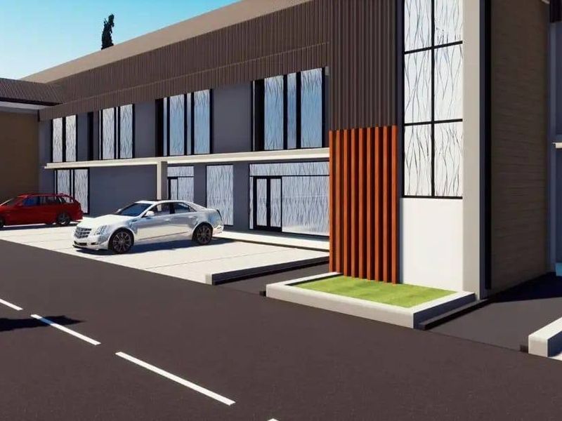 A digital architectural rendering of a modern residential building facade featuring clean lines, large windows, and paved parking areas.