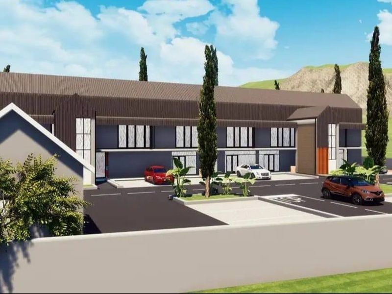 A 3D architectural rendering of a modern residential complex featuring a multi-level facade, paved parking area, and perimeter wall.