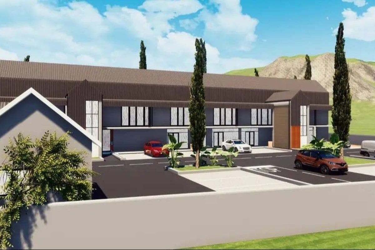 A 3D architectural rendering of a modern residential complex featuring a multi-level facade, paved parking area, and perimeter wall.