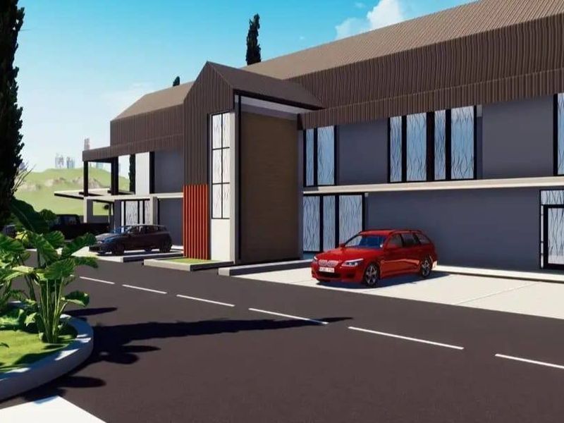 A digital architectural rendering of a modern residential development featuring paved driveways, covered parking, and landscaped garden areas.