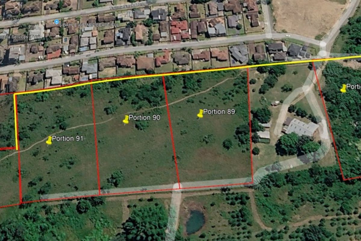 Aerial view of multiple land portions showing site boundaries and surrounding residential neighborhood context.