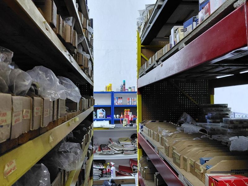 A commercial utility or storage space featuring heavy-duty industrial shelving units for organized inventory management.