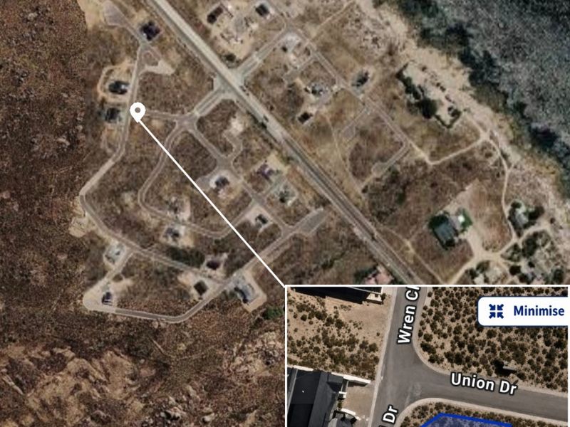 Aerial view of a vacant residential plot located at the corner of Sunbird Drive and Union Drive, featuring direct road access.