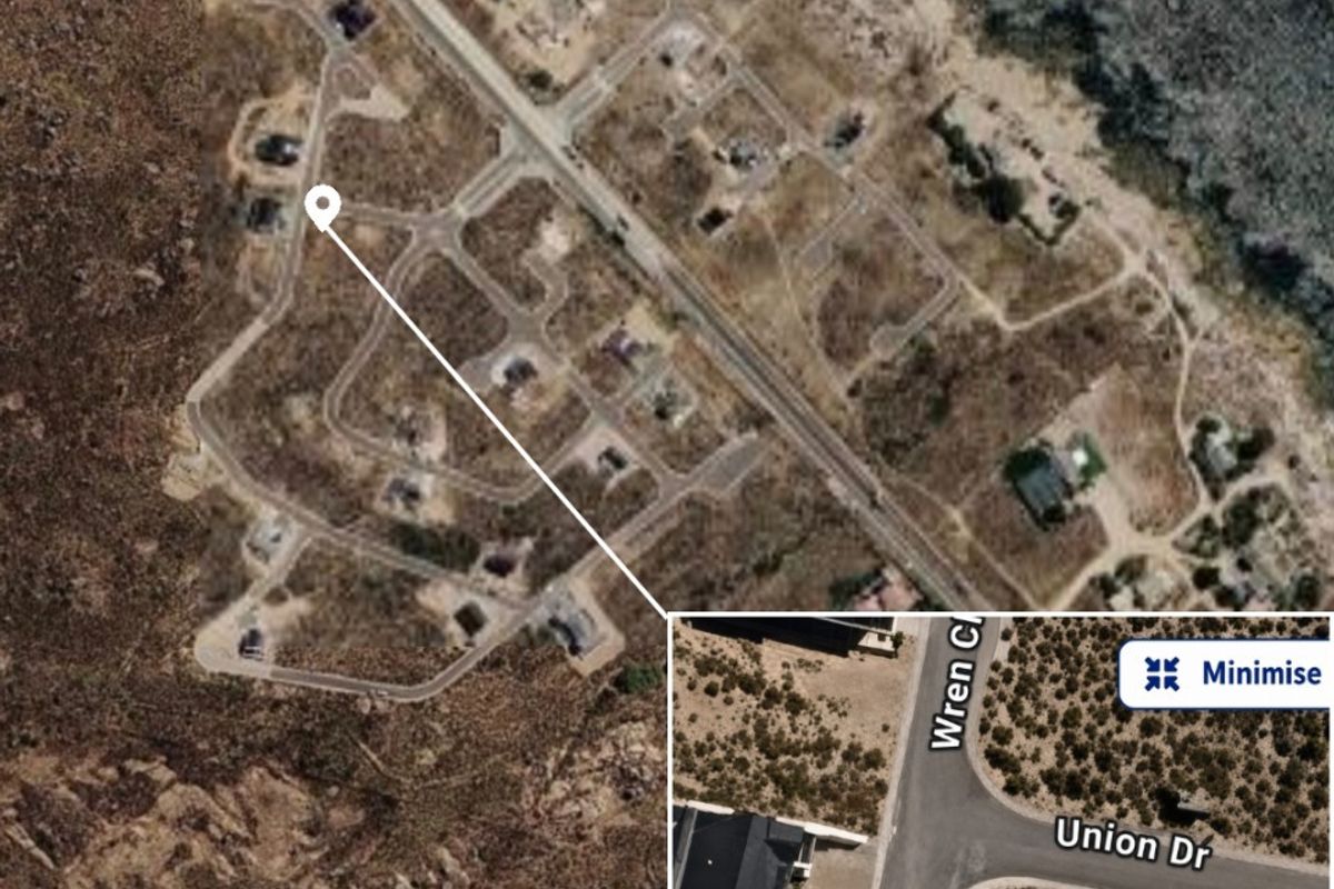 Aerial view of a vacant residential plot located at the corner of Sunbird Drive and Union Drive, featuring direct road access.