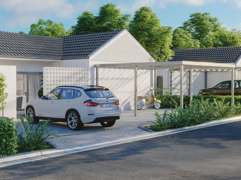 Modern single-story residential facade featuring a tiled roof, white brick exterior, and a functional carport with a decorative breeze block screen.