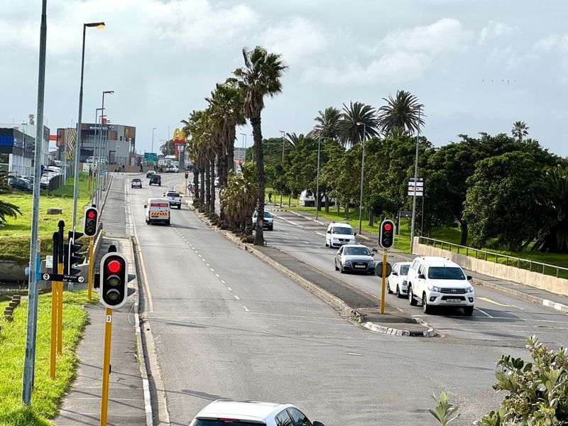 A view of the public street and surrounding infrastructure providing access to the industrial property location.