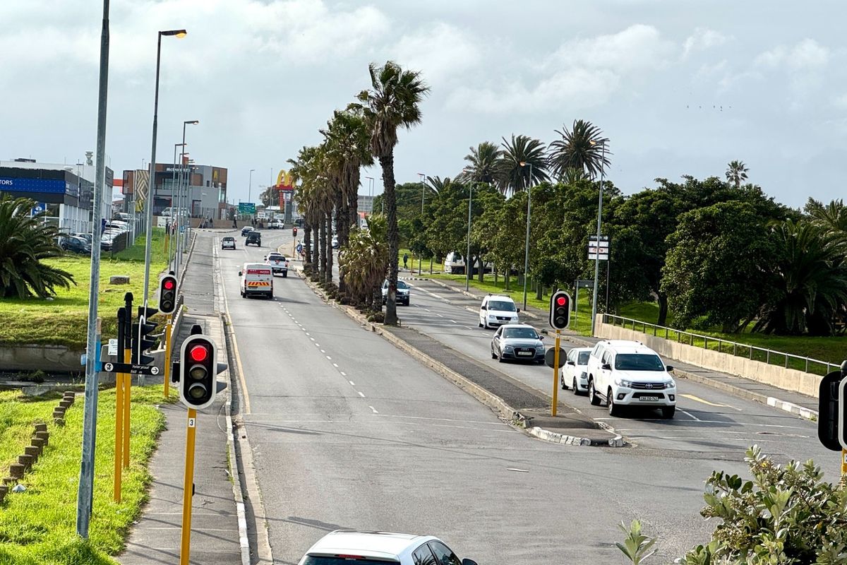 A view of the public street and surrounding infrastructure providing access to the industrial property location.