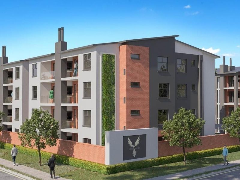A modern multi-story apartment complex featuring contemporary brick and render facades, private balconies with glass balustrades, and integrated vertical garden elements.