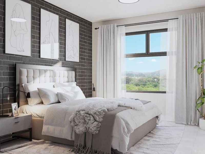 A modern, well-lit bedroom featuring a stylish dark brick accent wall, large window with natural light, and neutral contemporary finishes.