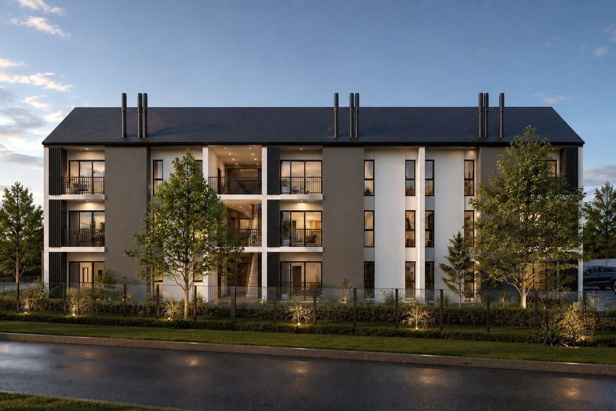 A modern three-story apartment building featuring a contemporary facade, private balconies with glass railings, and well-maintained landscaped grounds.