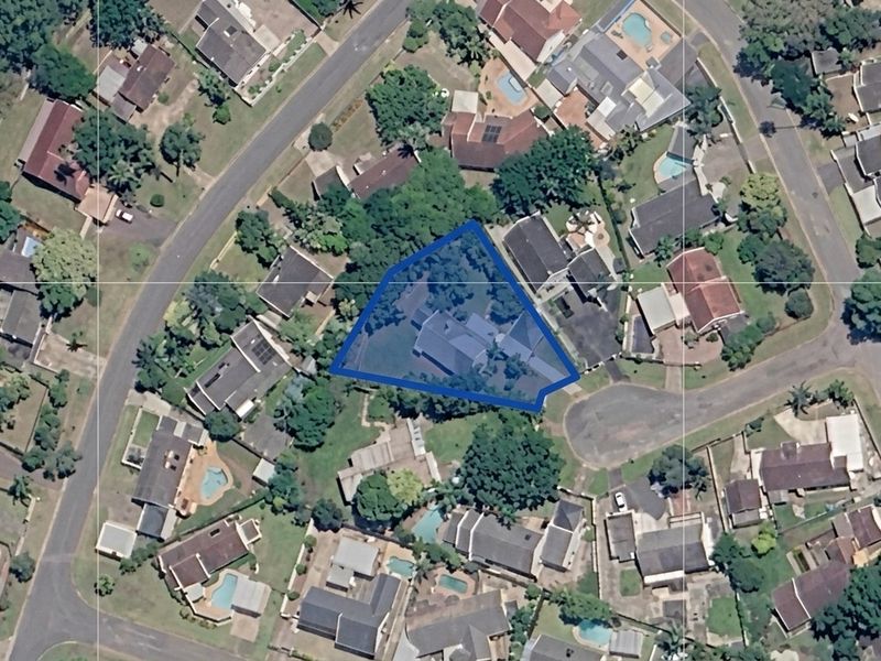 An aerial satellite view showing the property boundary and its position within the surrounding residential neighborhood.