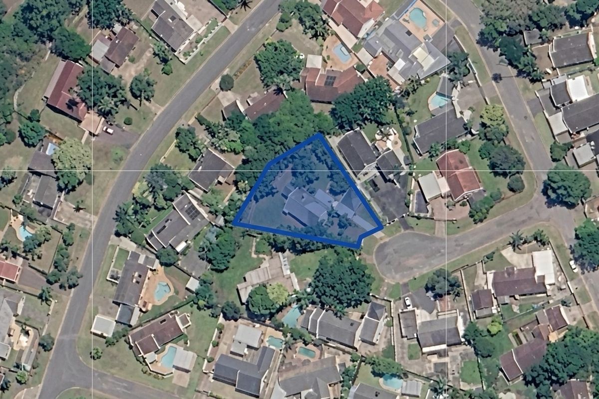 An aerial satellite view showing the property boundary and its position within the surrounding residential neighborhood.