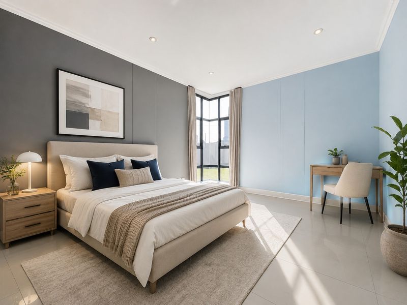 A bright and modern bedroom featuring tiled flooring, recessed downlights, and a large corner window that allows for ample natural light.