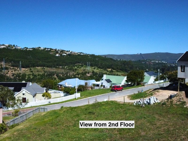 Elevated view from the second floor overlooking the surrounding residential neighbourhood, rolling hills, and local landscape.