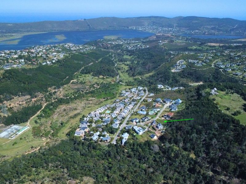 An aerial view of the residential estate, highlighting the property location within the surrounding natural landscape and coastal environment.