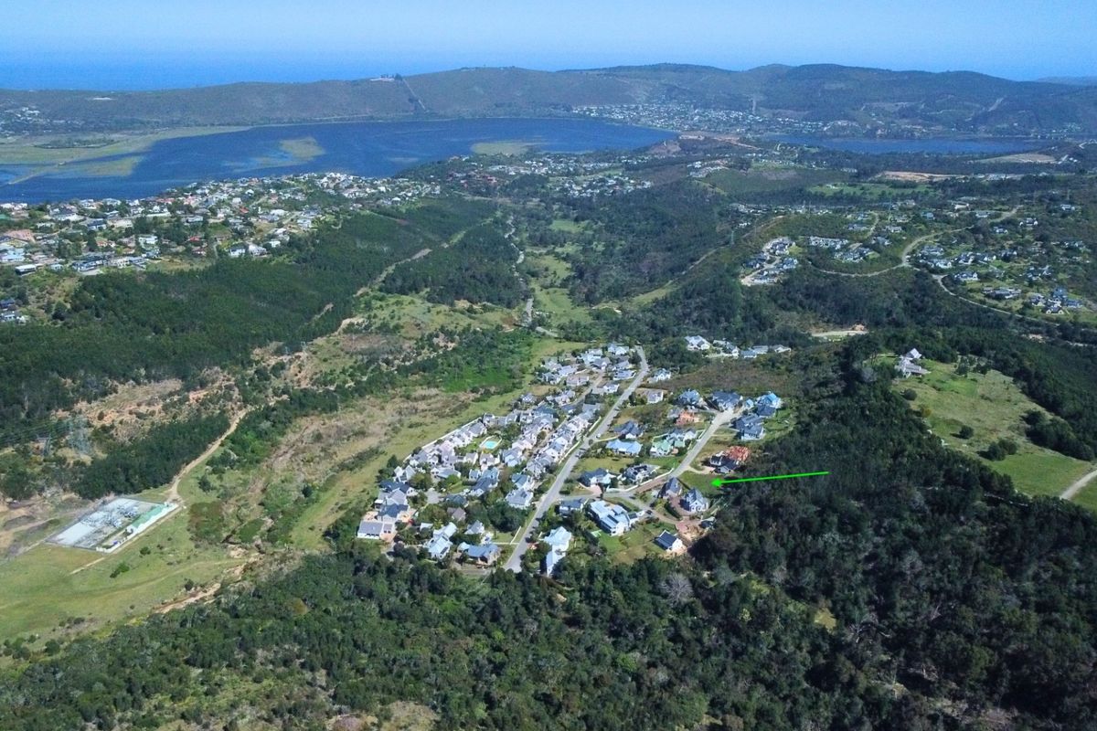 An aerial view of the residential estate, highlighting the property location within the surrounding natural landscape and coastal environment.