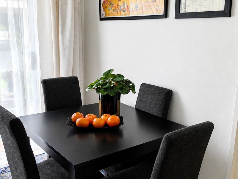 A bright dining area featuring a sliding glass door that provides natural light and access to the outdoor space.