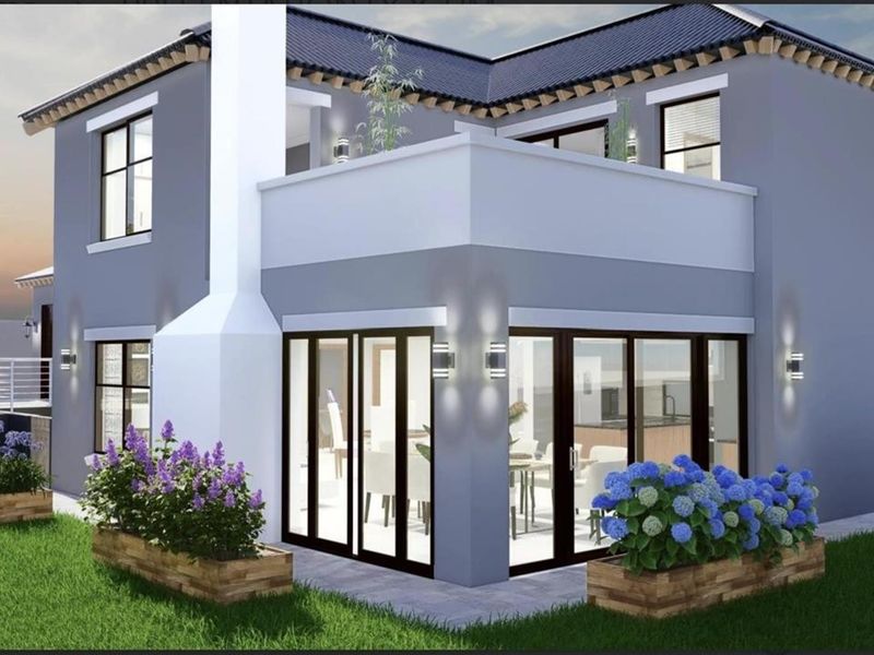 A modern two-story residential exterior featuring a balcony, large sliding glass doors, and a chimney stack, set within a landscaped garden.