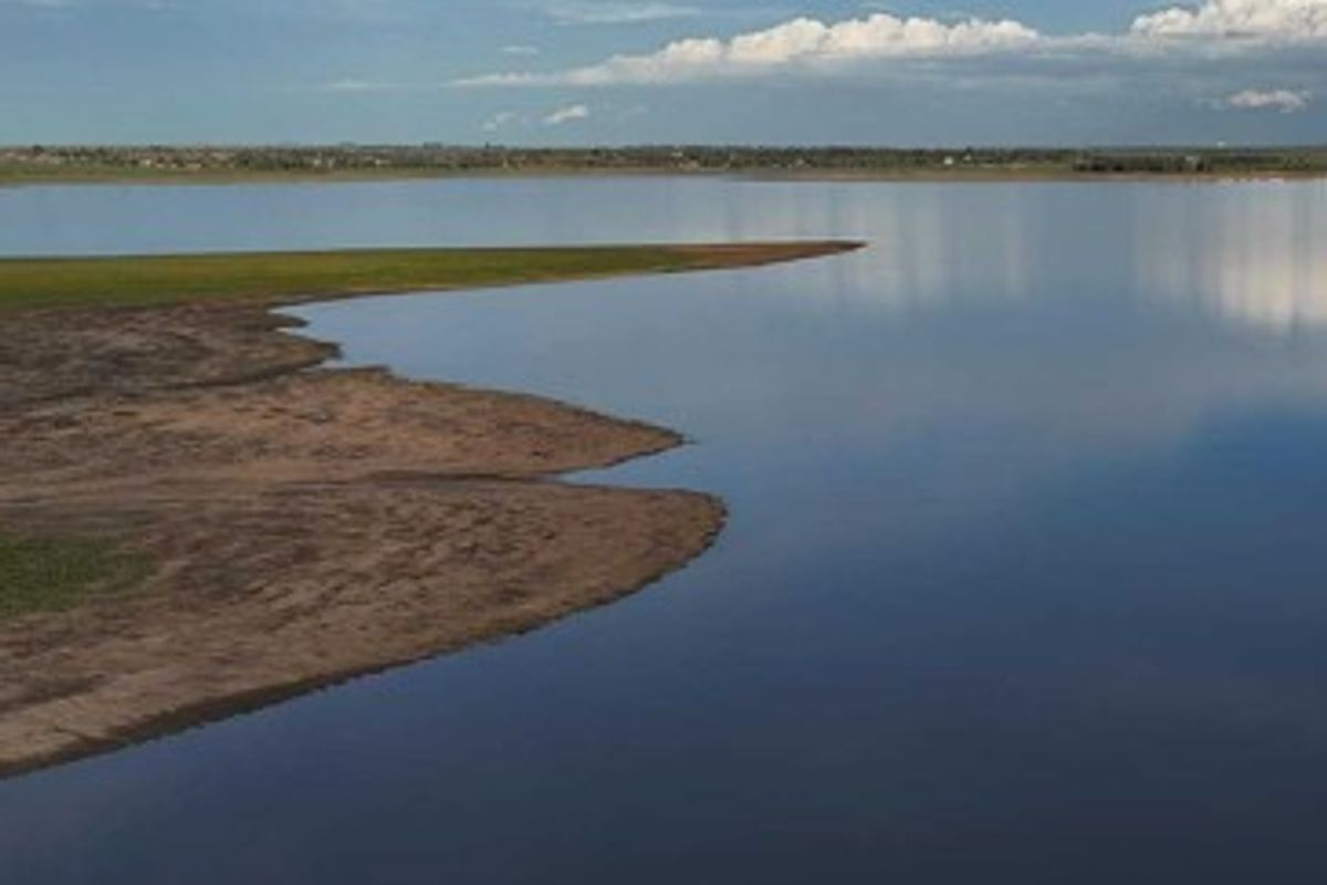 A scenic aerial view of the waterfront, showcasing the natural shoreline and expansive water body.