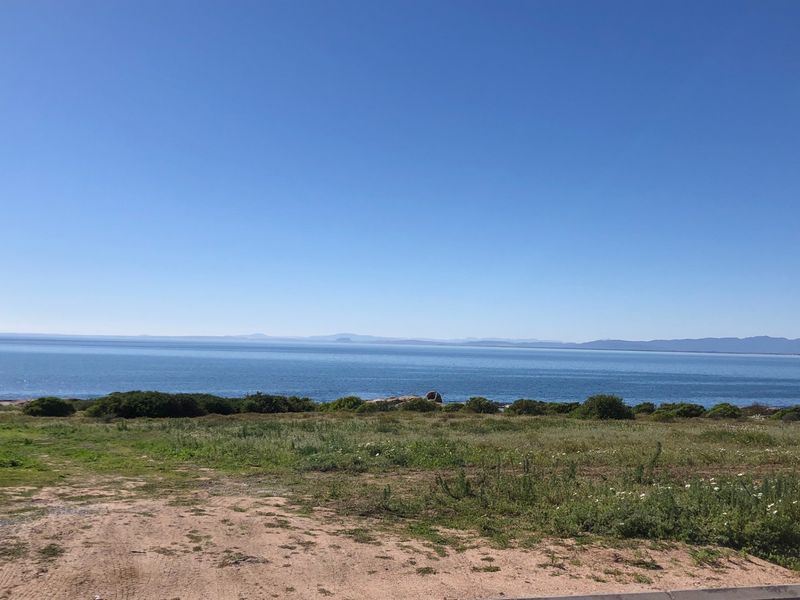 A scenic view of the ocean and coastline from the vacant residential property, showcasing natural landscape and horizon.