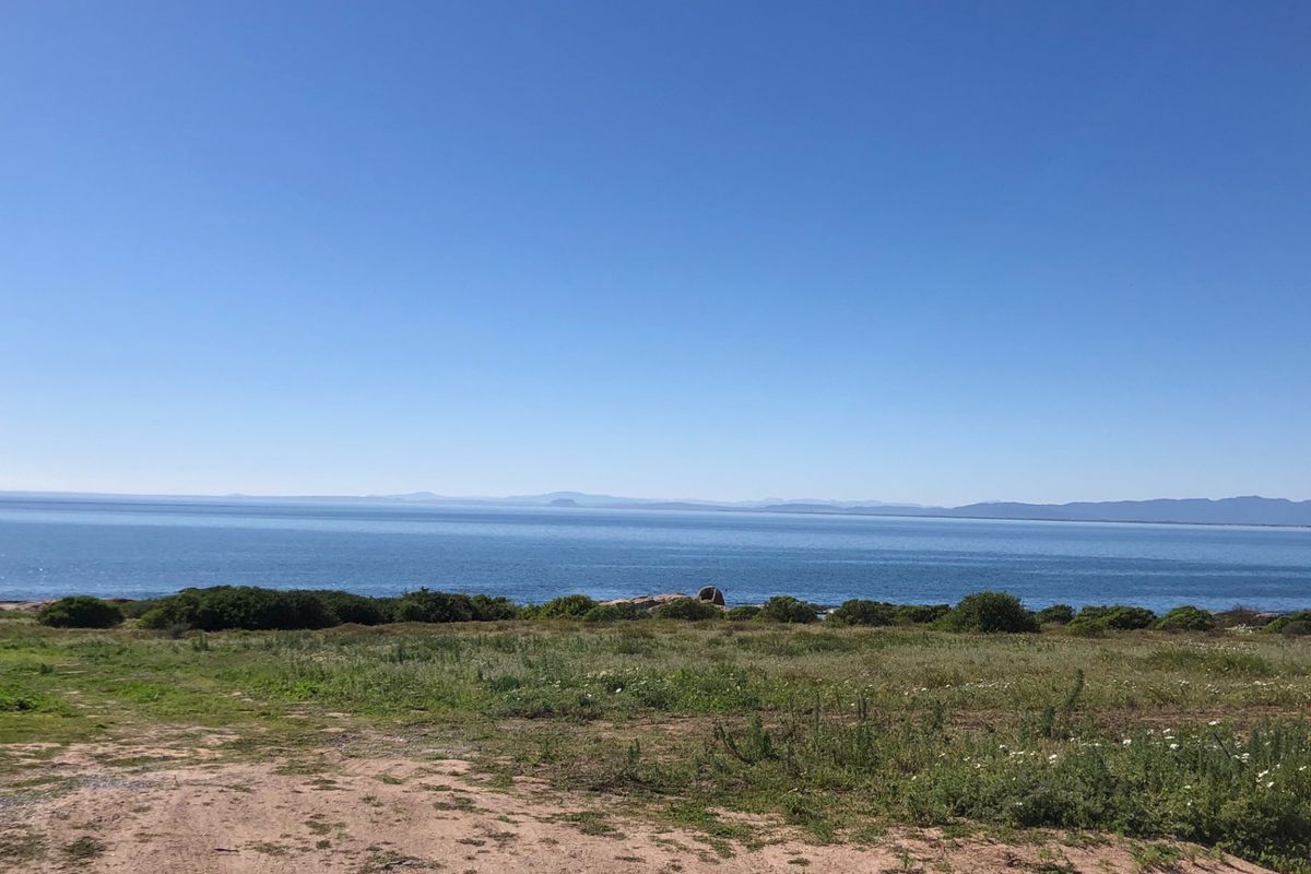A scenic view of the ocean and coastline from the vacant residential property, showcasing natural landscape and horizon.