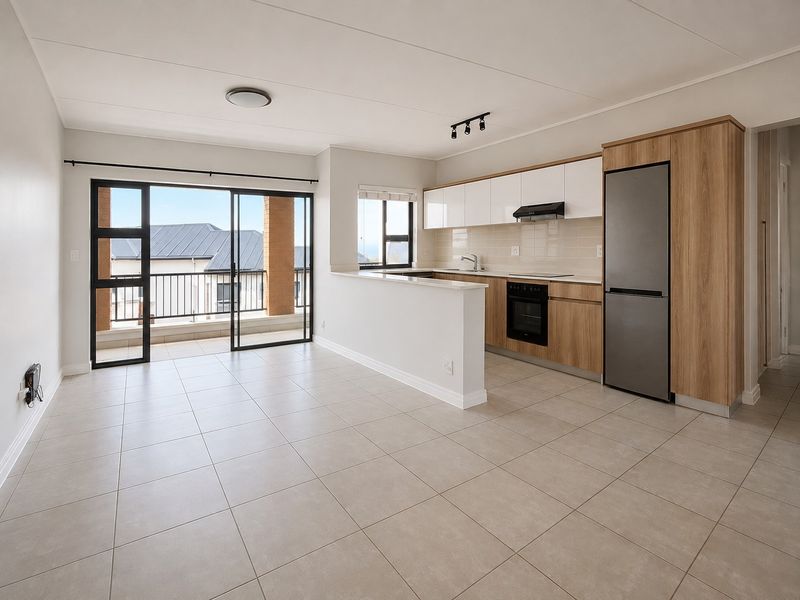 Modern open-plan kitchen and living area featuring neutral tiled flooring, sleek cabinetry, built-in appliances, and direct access to a private balcony.