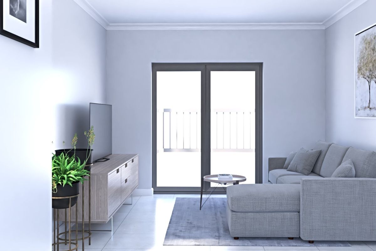A bright and modern living room featuring neutral tiled flooring, cove cornicing, and a large sliding glass door providing access to an outdoor area.