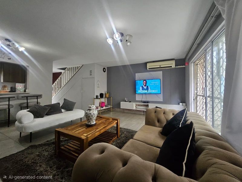 Open-plan living area featuring tiled floors, a staircase, a split-system air conditioner, and sliding glass doors leading to the exterior.