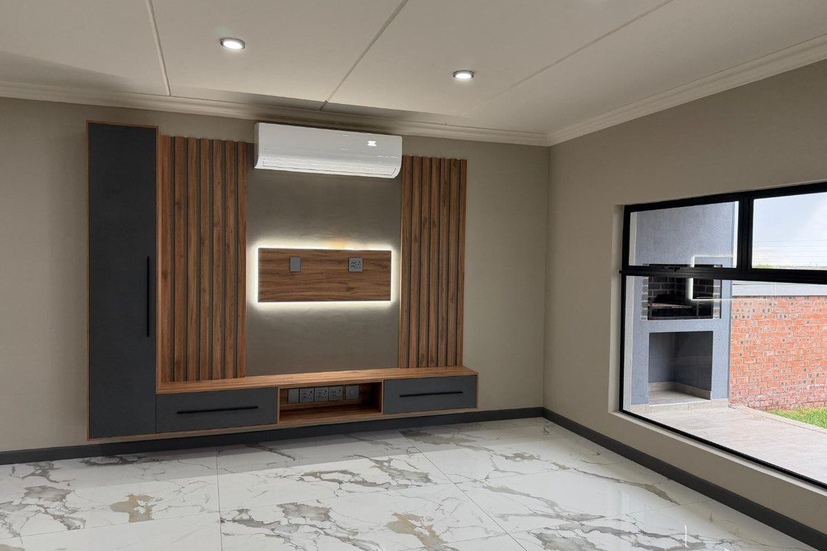 Modern living room featuring high-end marble-look floor tiles, custom timber slat media wall with integrated lighting, and a split-system air conditioner.