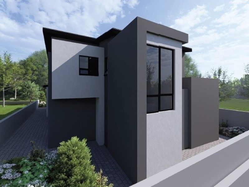 A modern two-story residential property featuring a contemporary facade with clean lines, paved driveway, and secure boundary walling.