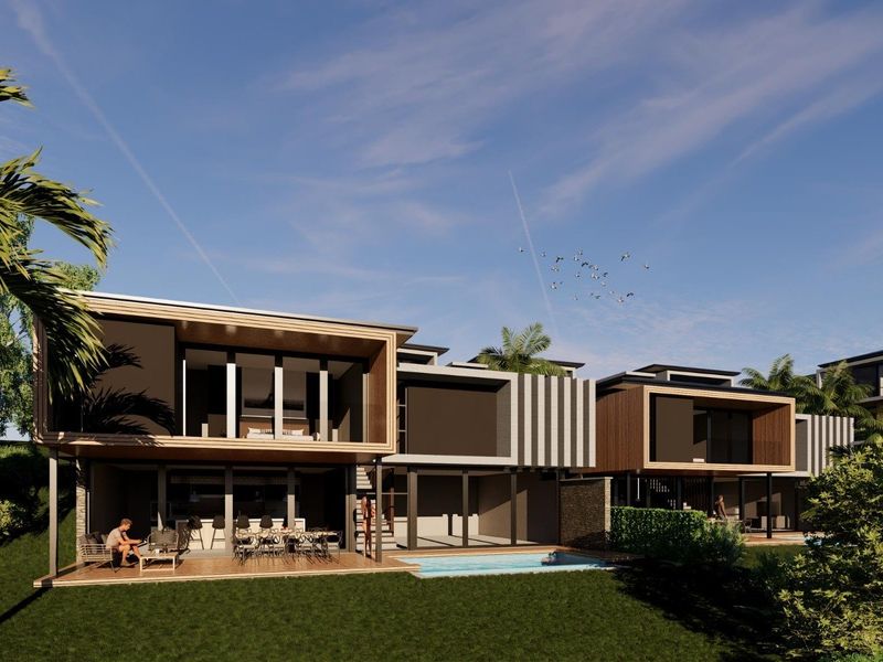Modern rear elevation featuring a swimming pool, timber decking, and a covered patio area with contemporary architectural design.