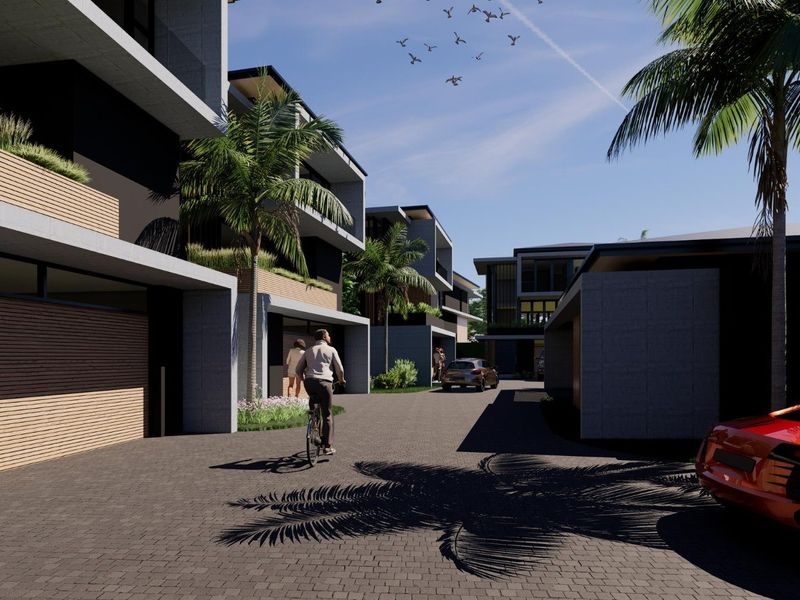 A modern residential complex featuring contemporary concrete architecture, timber accents, and paved driveways in a well-designed estate setting.