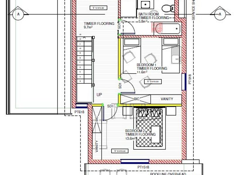 Architectural floor plan showing the layout of two bedrooms, a bathroom, and an outdoor balcony area.