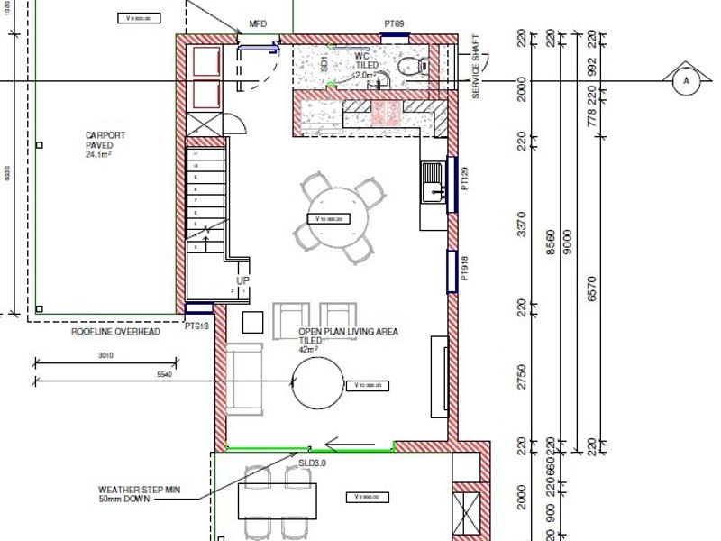 Architectural floor plan showing an open plan living area, kitchen, bathroom, staircase, and an attached carport.