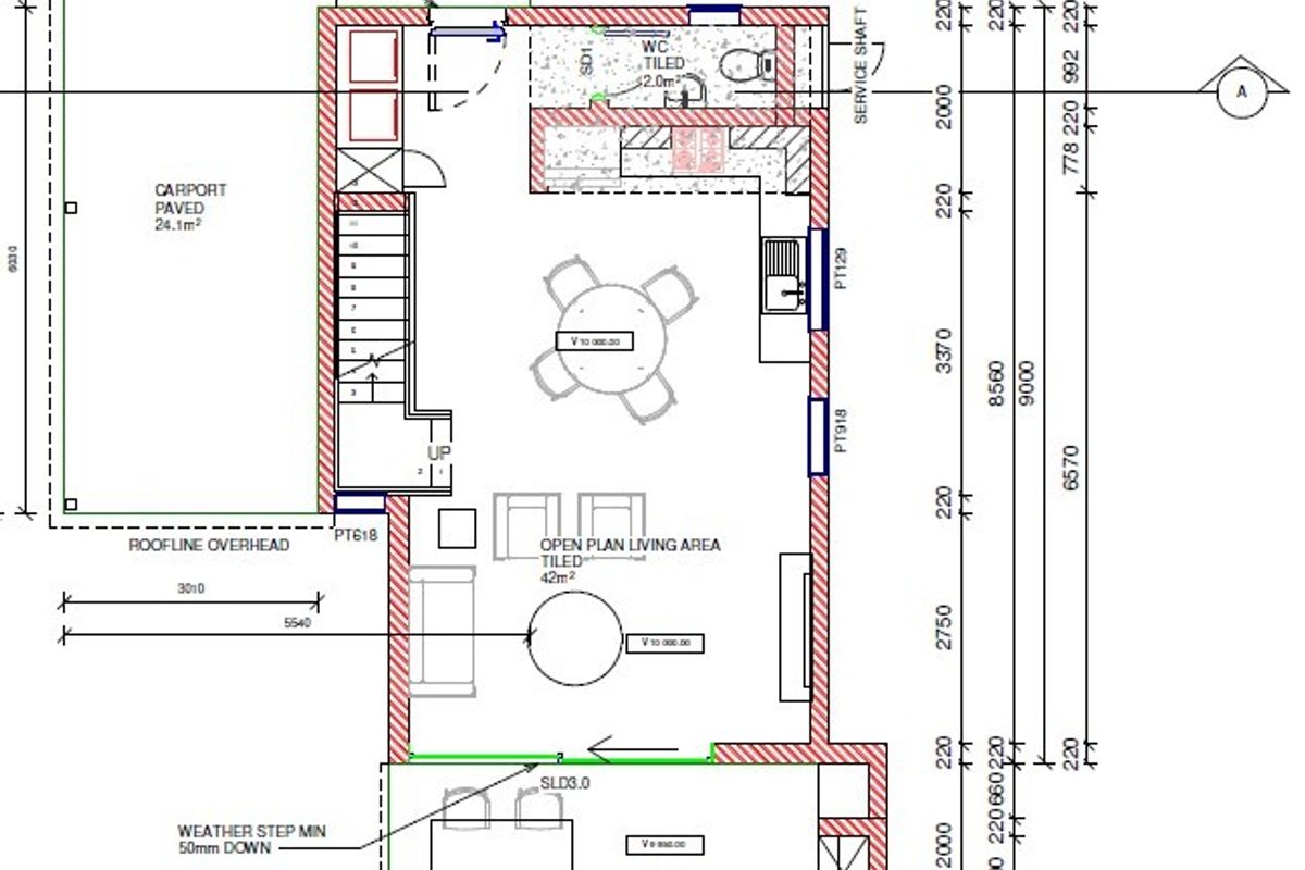 Architectural floor plan showing an open plan living area, kitchen, bathroom, staircase, and an attached carport.