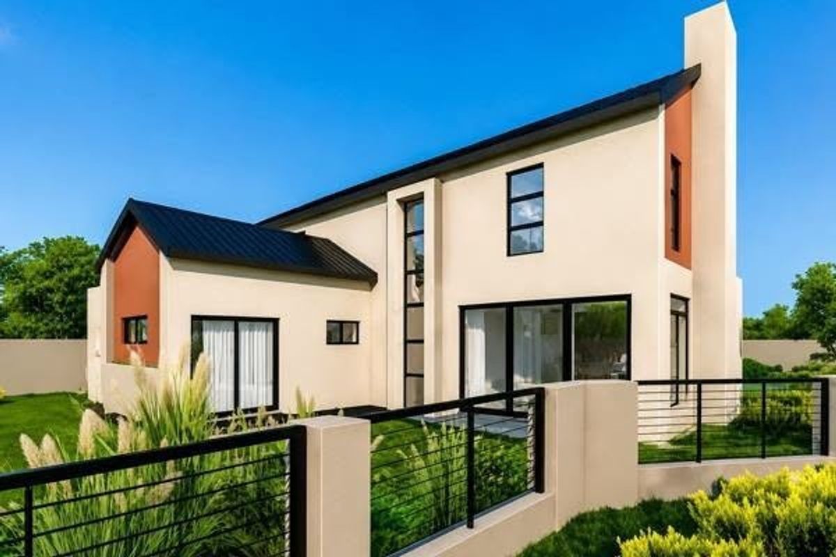 Modern two-story residential home featuring a contemporary architectural design with a metal roof, stucco finish, and large sliding glass doors opening to the garden.