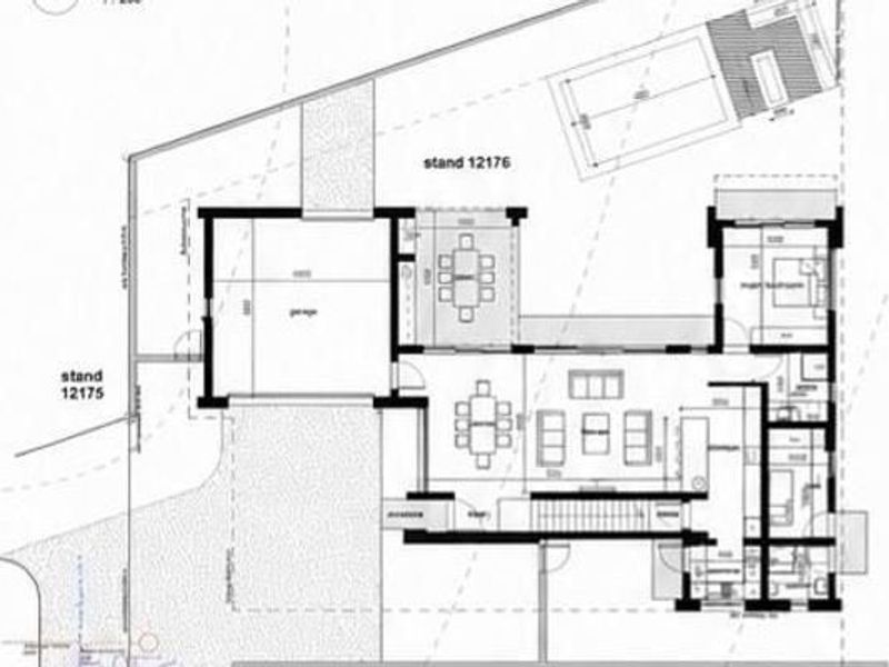 Architectural floor plan showing the layout of the house, including garage, living areas, bedrooms, and outdoor pool space.