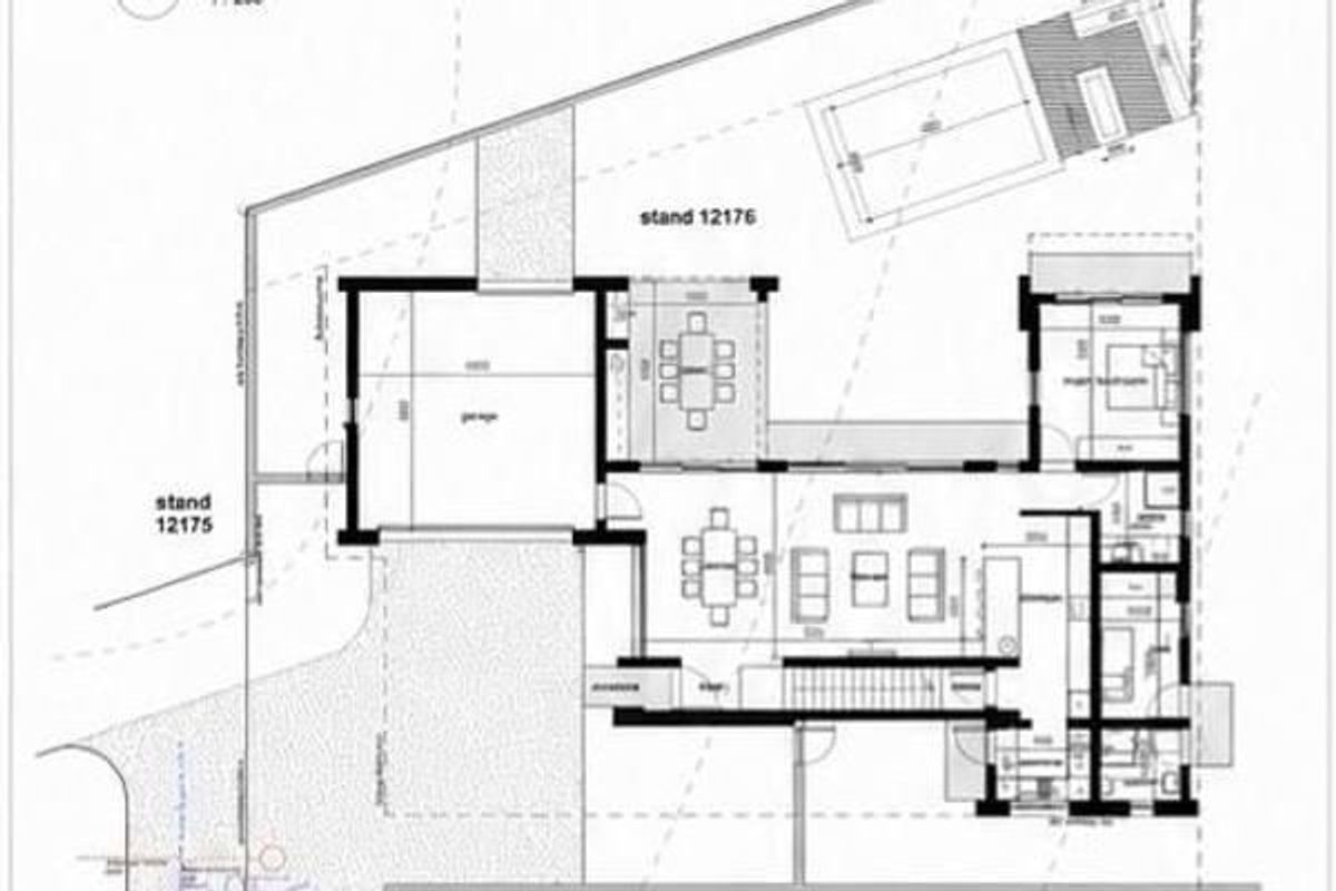 Architectural floor plan showing the layout of the house, including garage, living areas, bedrooms, and outdoor pool space.