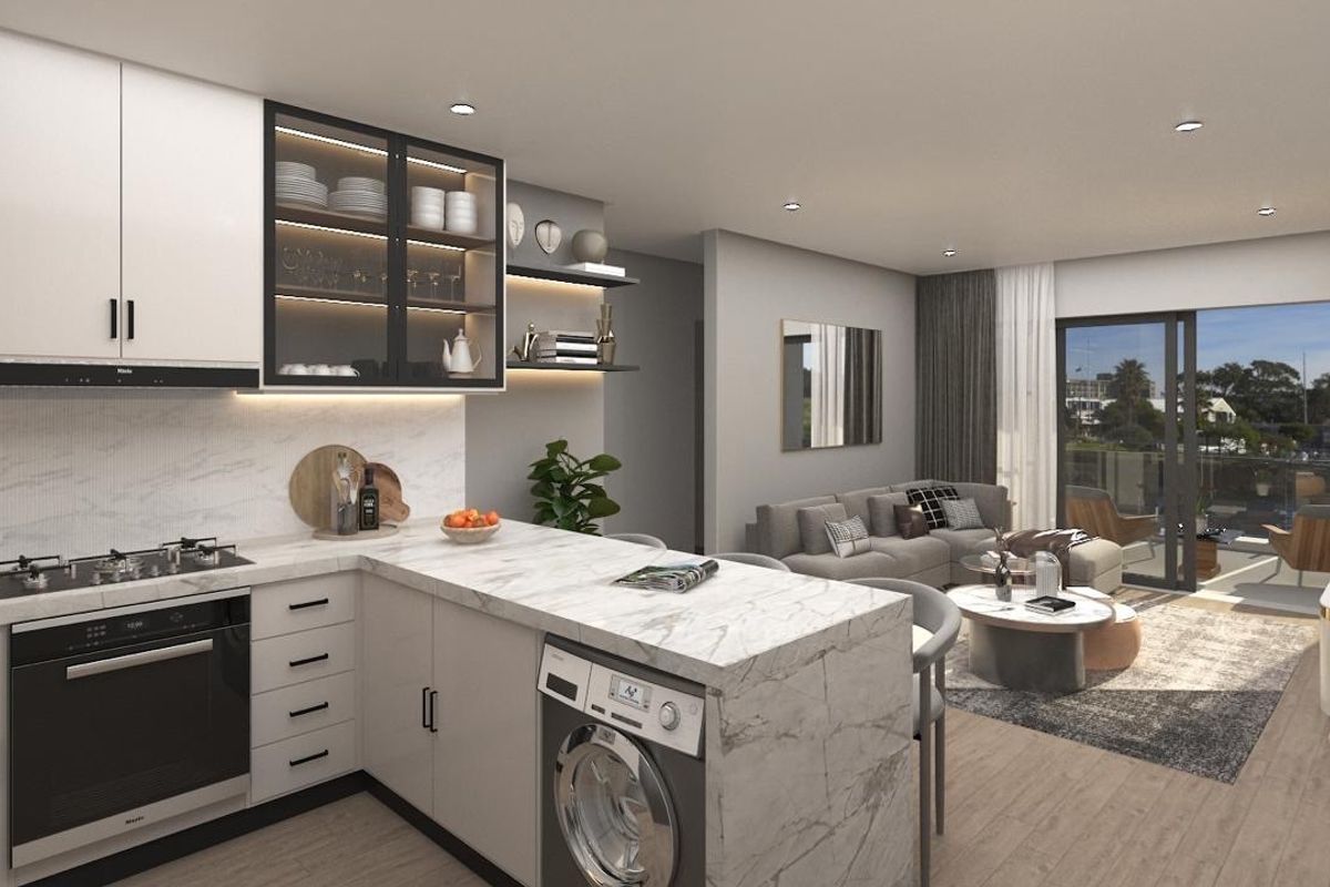 Modern open-plan kitchen and living area featuring high-end finishes, integrated appliances, marble-look countertops, and seamless access to a private balcony.