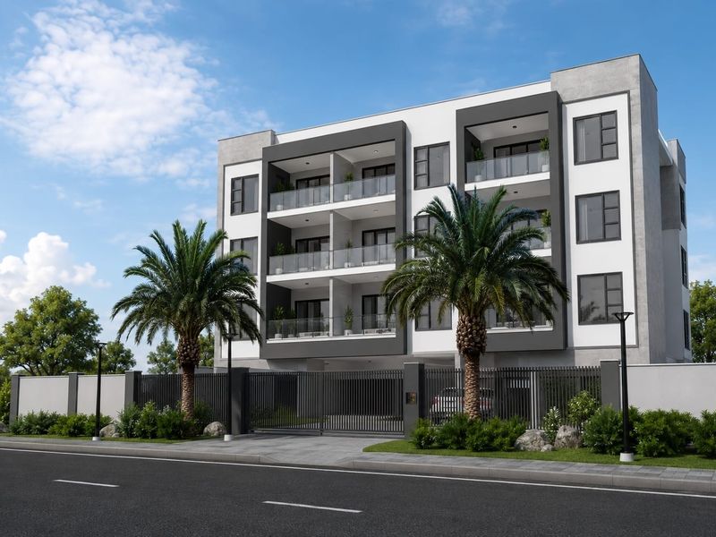 Modern multi-story apartment building featuring contemporary facade design, glass-fronted balconies, secure gated entrance, and landscaped perimeter.