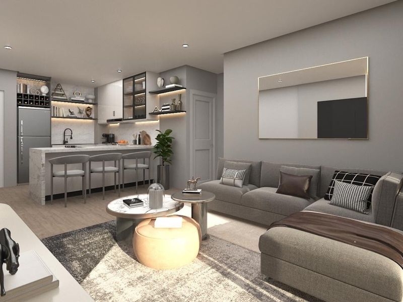 Modern open-plan living area featuring a sleek kitchen with stone island, integrated cabinetry, and contemporary finishes, seamlessly flowing into the comfortable lounge space.