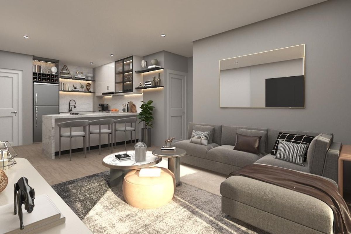 Modern open-plan living area featuring a sleek kitchen with stone island, integrated cabinetry, and contemporary finishes, seamlessly flowing into the comfortable lounge space.