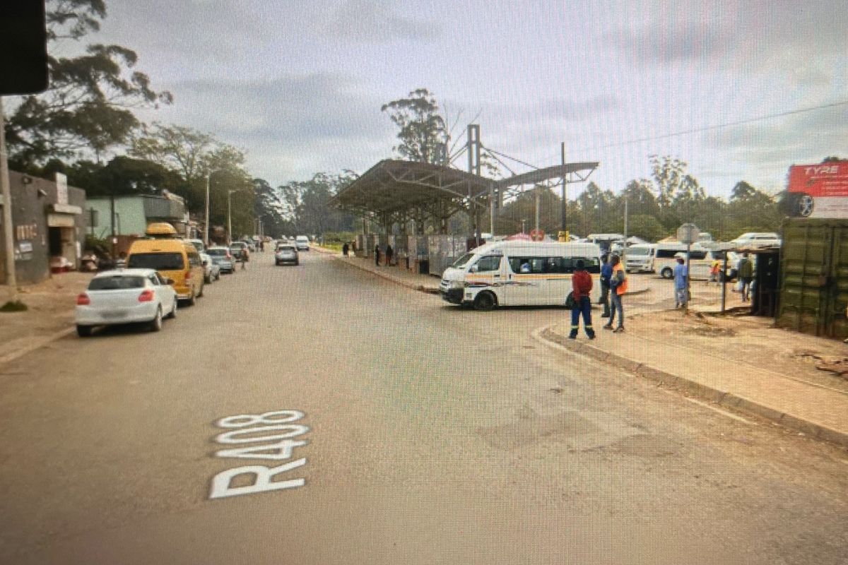 Street view of the R408 road showing surrounding commercial infrastructure, public transport facilities, and general road access.