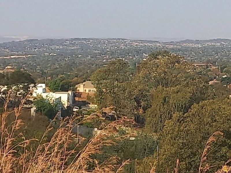 A scenic elevated view overlooking the surrounding residential neighborhood and lush landscape.